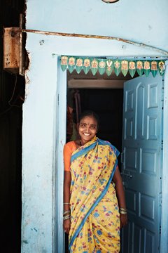 Smiling woman standing in doorway