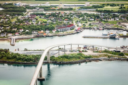 Bridge spanning islands and village