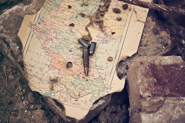 Bullets laying on antique map
