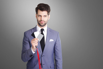 Cards for white balance. Businessman holding in his hand a white balance card