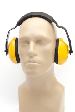 yellow earmuffs on white background