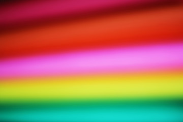 Abstract paper stack defocused colourful background. Paper stack of different colors defocused