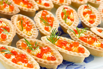 Tartlets with red caviar. Cocktail party snacks with red caviar