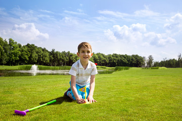 Little boy golfer