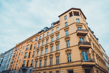 Yellow Urban Apartment Building with Balconies