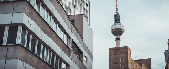 office buildings in a row with tv tower