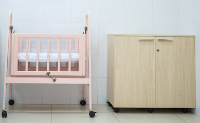 Cradle newborn room interior. Wooden Cot Frame for a new baby.