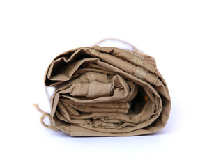 Closeup of folded trousers, clothes on a white background