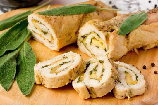 Stuffed roll of chicken breast with cheese and sage