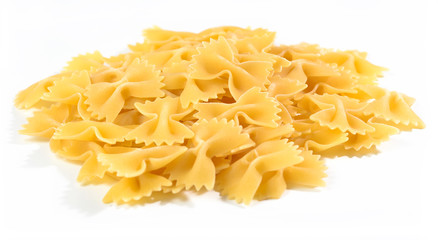Heap of uncooked italian pasta farfalle on a white