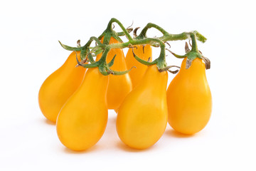 Bunch of yellow cherry tomatoes isolated