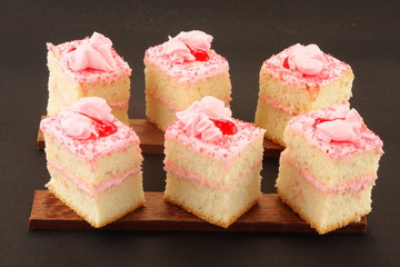 Home made fresh strawberry cream cake in black background,.