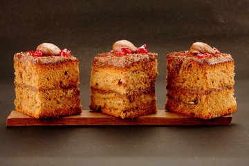 Home made fresh chocolate cream cake in black background,.