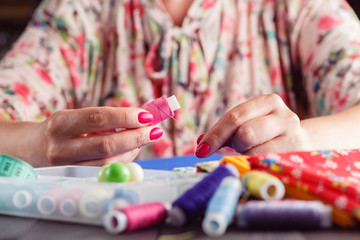 Sewing craft needle textile thread in human finger