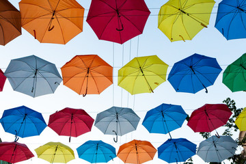 Fototapeta na wymiar Colored umbrellas floating in the salt Lane St. Petersburg
