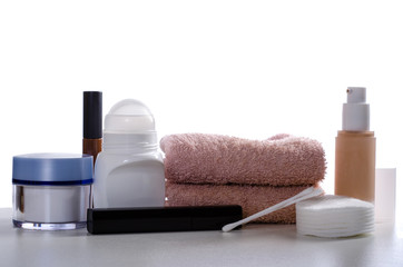 Cosmetics set against a white background, front view