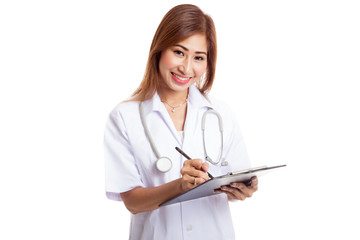Asian young female doctor write on a clipboard