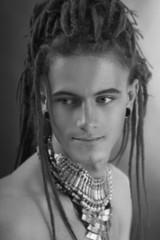 Young man's portrait. Stylish handsome sexy Guy with Dreadlocks