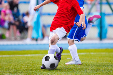 Naklejka premium Kids Playing Soccer Football Match. Sport Soccer Tournament for Youth Teams.