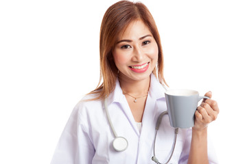 Young Asian female doctor hold a mug and smile