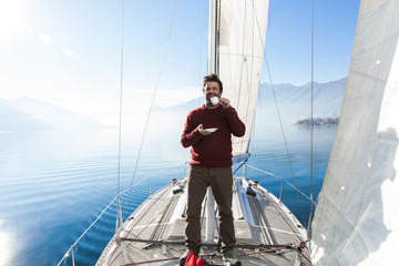 woman makes a coffee break on the sail boat