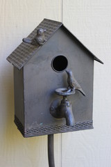 Brown metal bird house