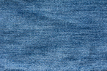 Closed up of blue creased denim jeans texture