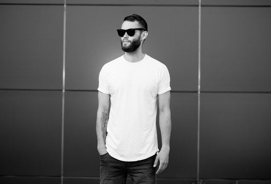 Hipster wearing white blank t-shirt with space for your logo