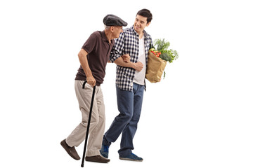 Kind man helping a senior with groceries