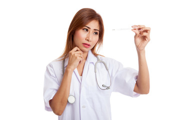 Young Asian female doctor  think with thermometer