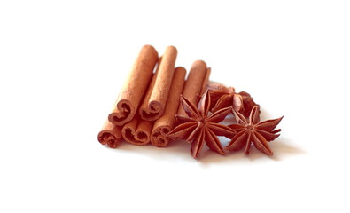 Cinnamon and anise stars on white background