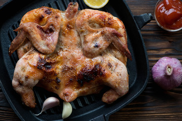 Above view of roasted crispy chicken tobacco, close-up