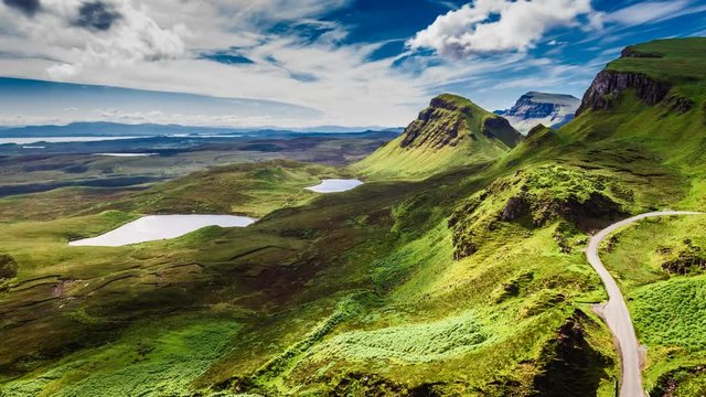 Dynamic sky over valley in mountain Quiraing, Scotland, United Kingdom, 4k, timelapse