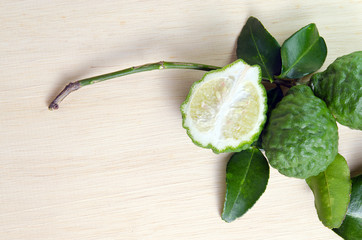 Bergamots fruit with leaf on wooden board