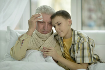 Portrait of sick  senior man with grandson