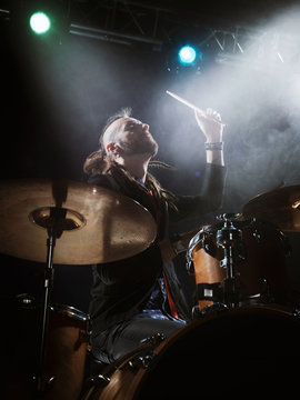 Silhouette of the drummer on stage.