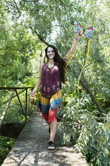 Girl with Kite in a bridge on the river