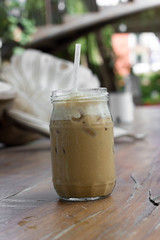 Iced coffee with milk is on the table.