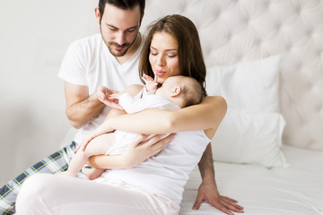 Happy family with newborn baby