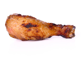Grilled chicken leg on white background.