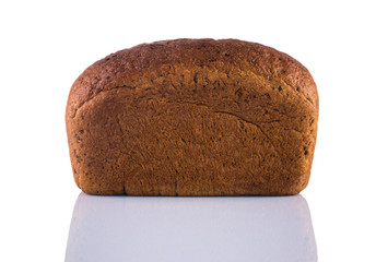 Loaf of rye bread isolated on white background with reflection