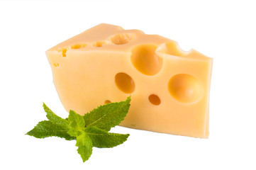 Piece of cheese and mint leaves isolated on white background