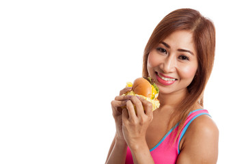 Beautiful Asian healthy girl enjoy eating  hamburger