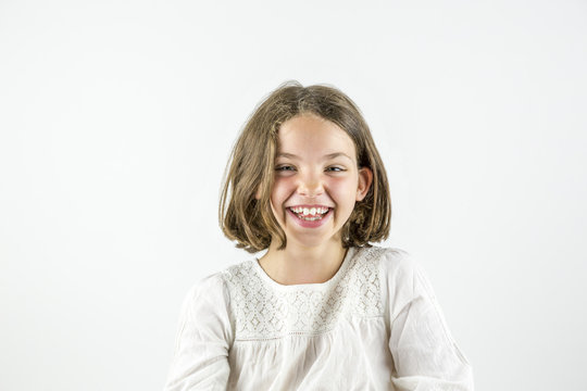 Portrait of cute happy giggling girl isolated on white. 