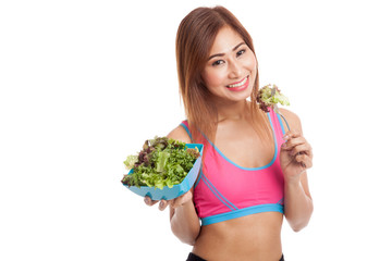 Beautiful Asian healthy girl enjoy eating  salad