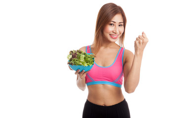 Beautiful Asian healthy girl fist up with salad