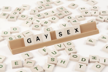 Gay Sex - Diritti gay, lesbiche e trans scritti con tessere di legno. 