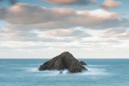 Time lapse view of waves on rock