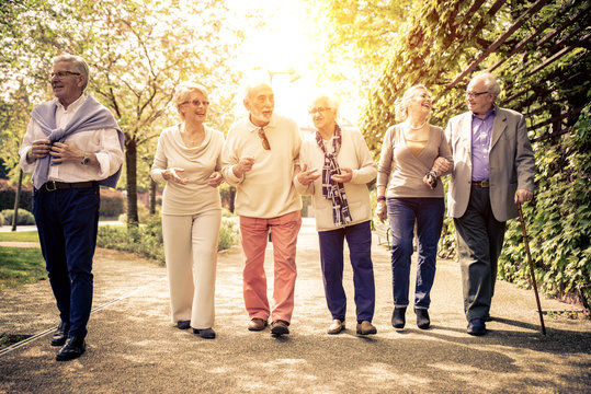 Group of old people walking outdoor