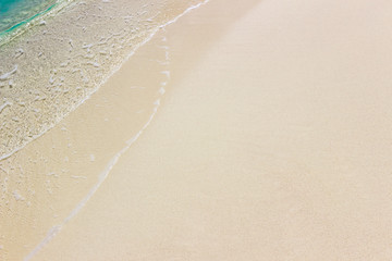 Fototapeta na wymiar White sand and sea wave background